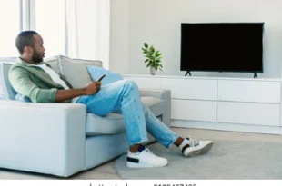 young black man watching tv 260nw 2198497495