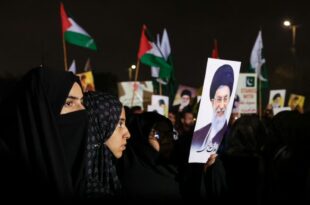 shiite muslim supporter of the imamia student organization iso holds a portrait of iran s supreme le 1772315251 ea56604263a962f56604263a903666v